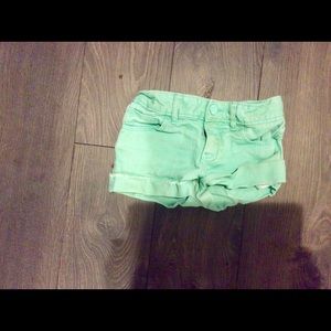 Green denim shorts